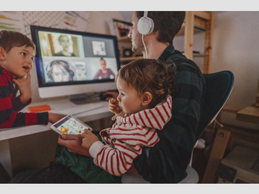 picture of man with his daughter working from home