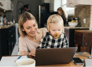 Mom and child using modem and router to get on wi-fi