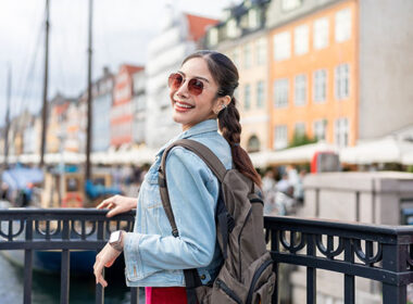 Asian young woman backpacker traveler traveling outdoors