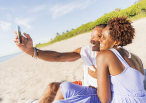 A picture of a man and a woman on a beach
