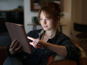 A picture of a woman using a tablet