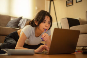 College student studying on laptop with AT&T Internet