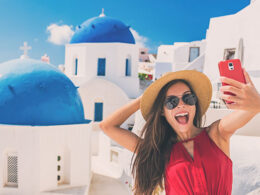 woman-taking-selfie-in-santorini