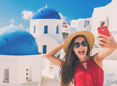 woman-taking-selfie-in-santorini