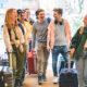 Group of university college tourist walking inside the hotel with luggage