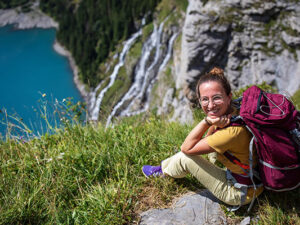 Tourist in the mountains in Switzerland on Lake Oeschinensee