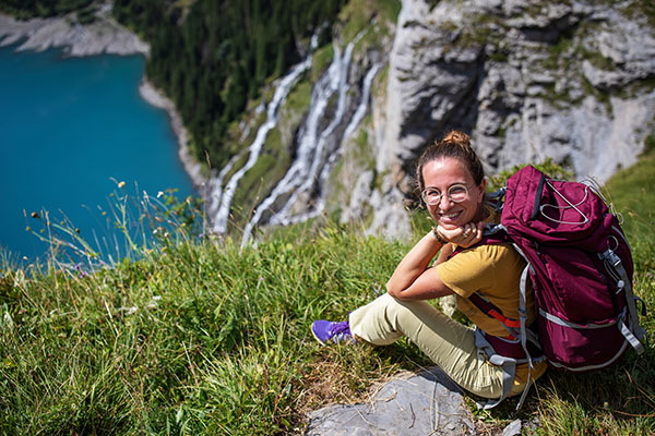 Tourist in the mountains in Switzerland on Lake Oeschinensee