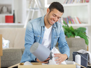a young man is moving houses