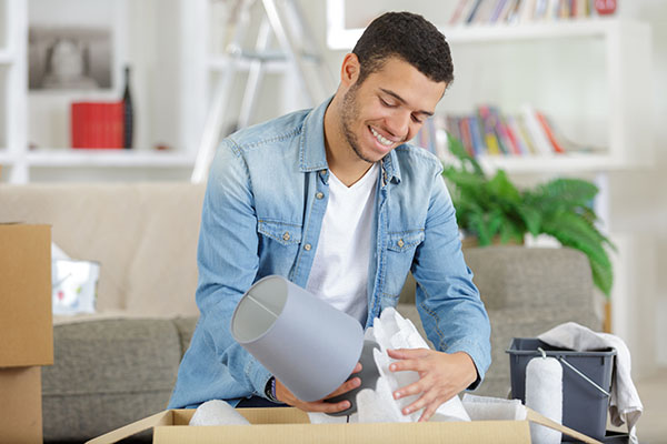 a young man is moving houses